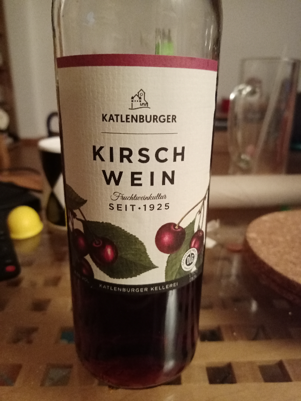 A photograph of a bottle of wine labelled 'Katlenburger Kirschwein'