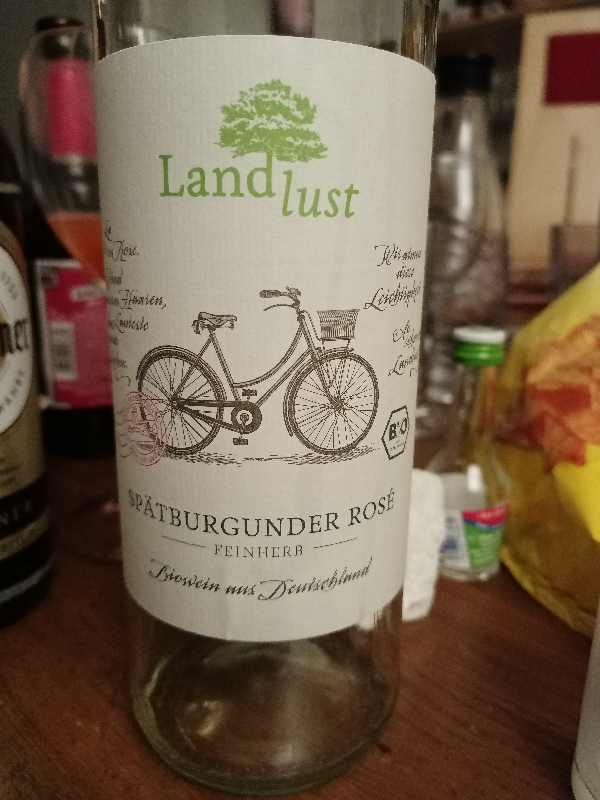 A photograph of a bottle of wine labelled 'Landlust Spätburgunder Rosé'